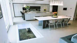 Kitchen with a glass floor into games room
